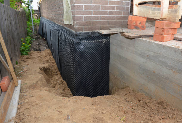 SJ Waterproofing Pros technician performing targeted Waterproofing assessment in Woodbine, NJ